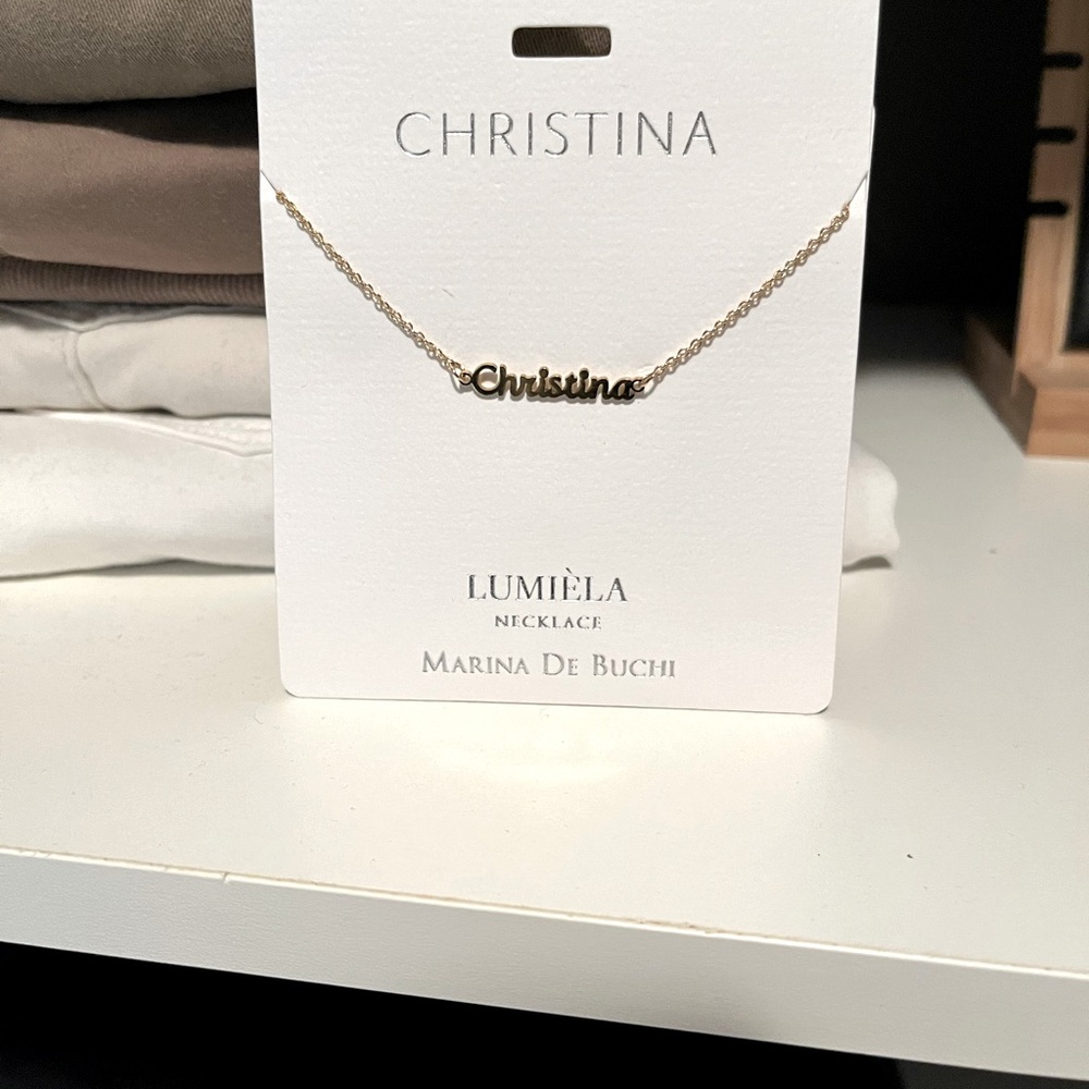Necklace says “Christina”
